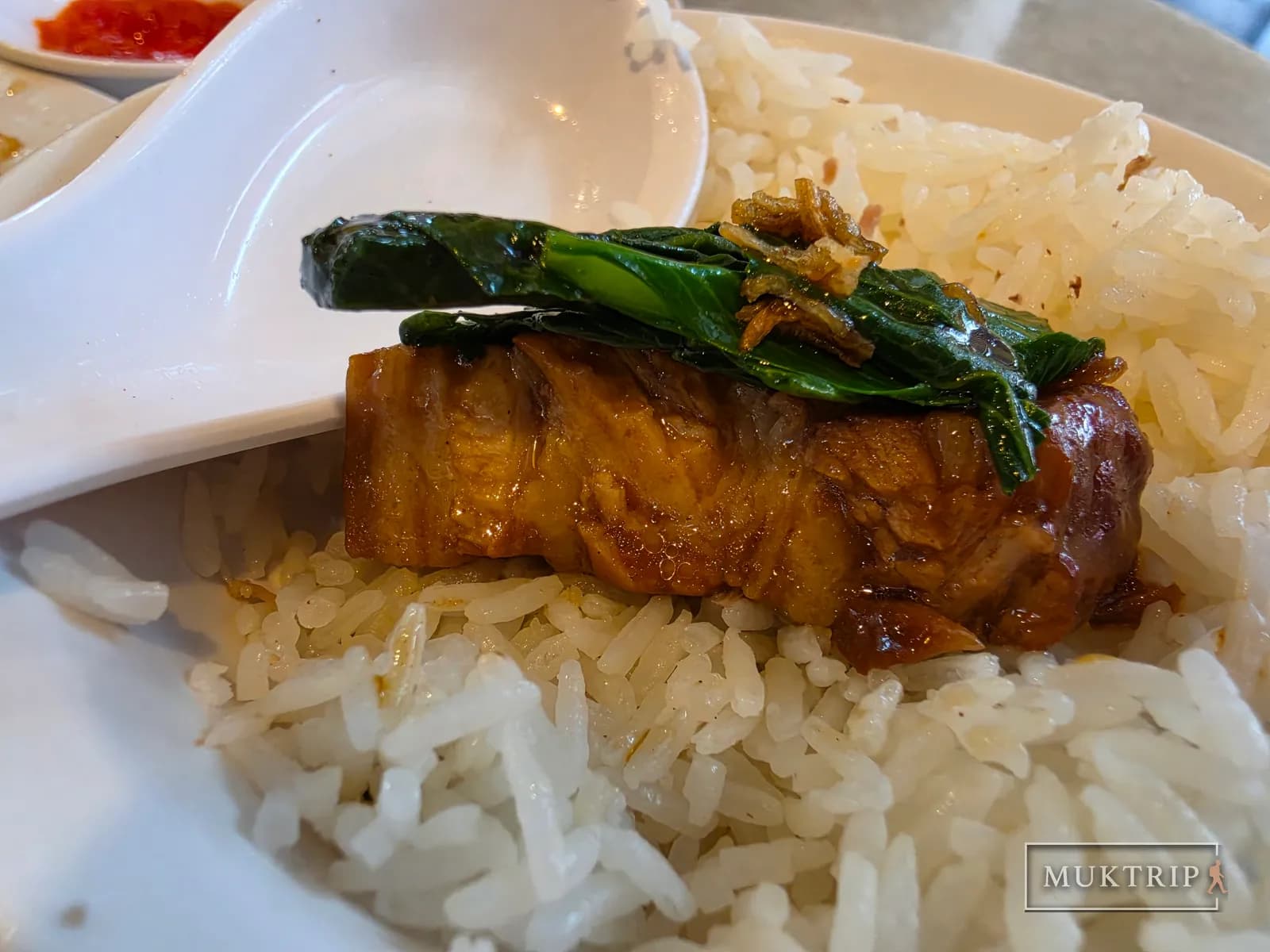 Braised pork belly and stir-fried cai xin served over rice