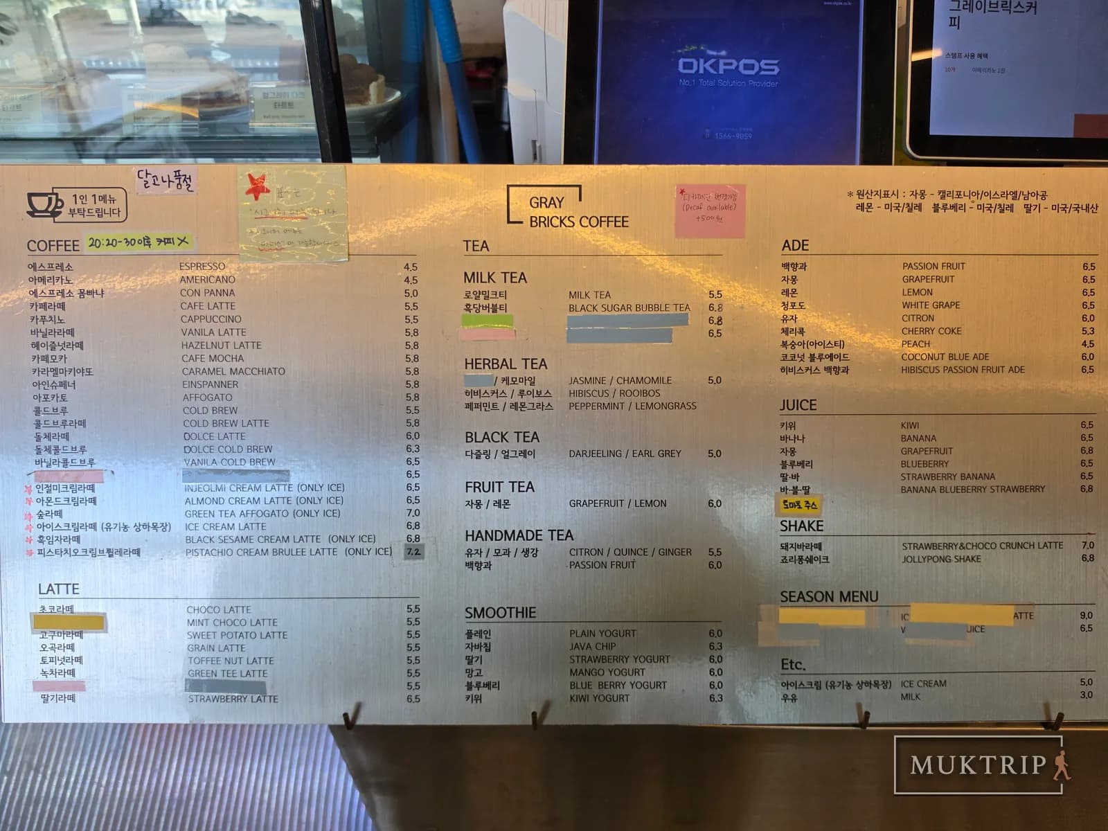 A drink menu listing everything from coffee to ades and shakes