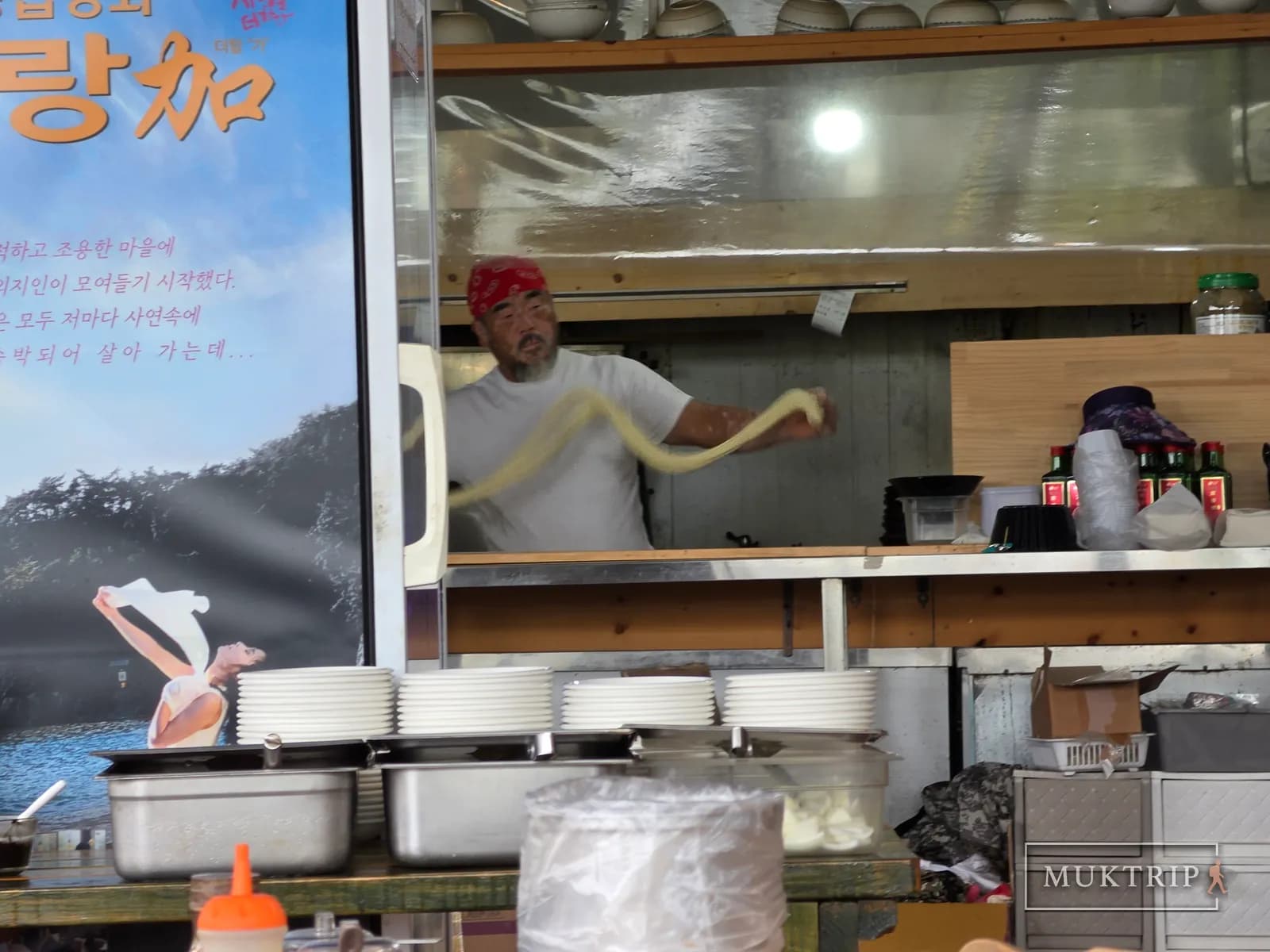 Stretching dough by hand to make hand-pulled noodles