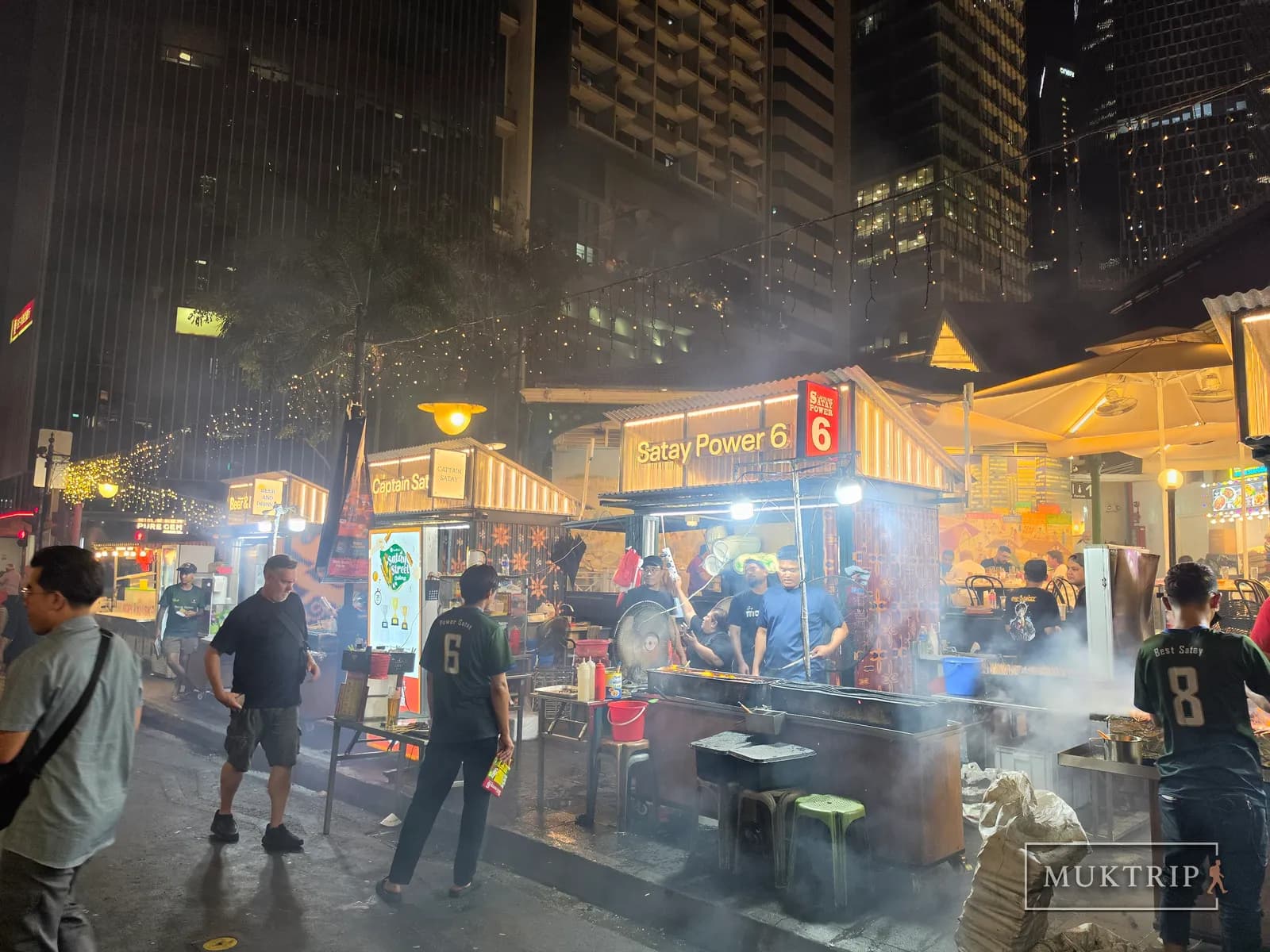 Grilling satay amid smoke at the 'Satay Power 6' stall