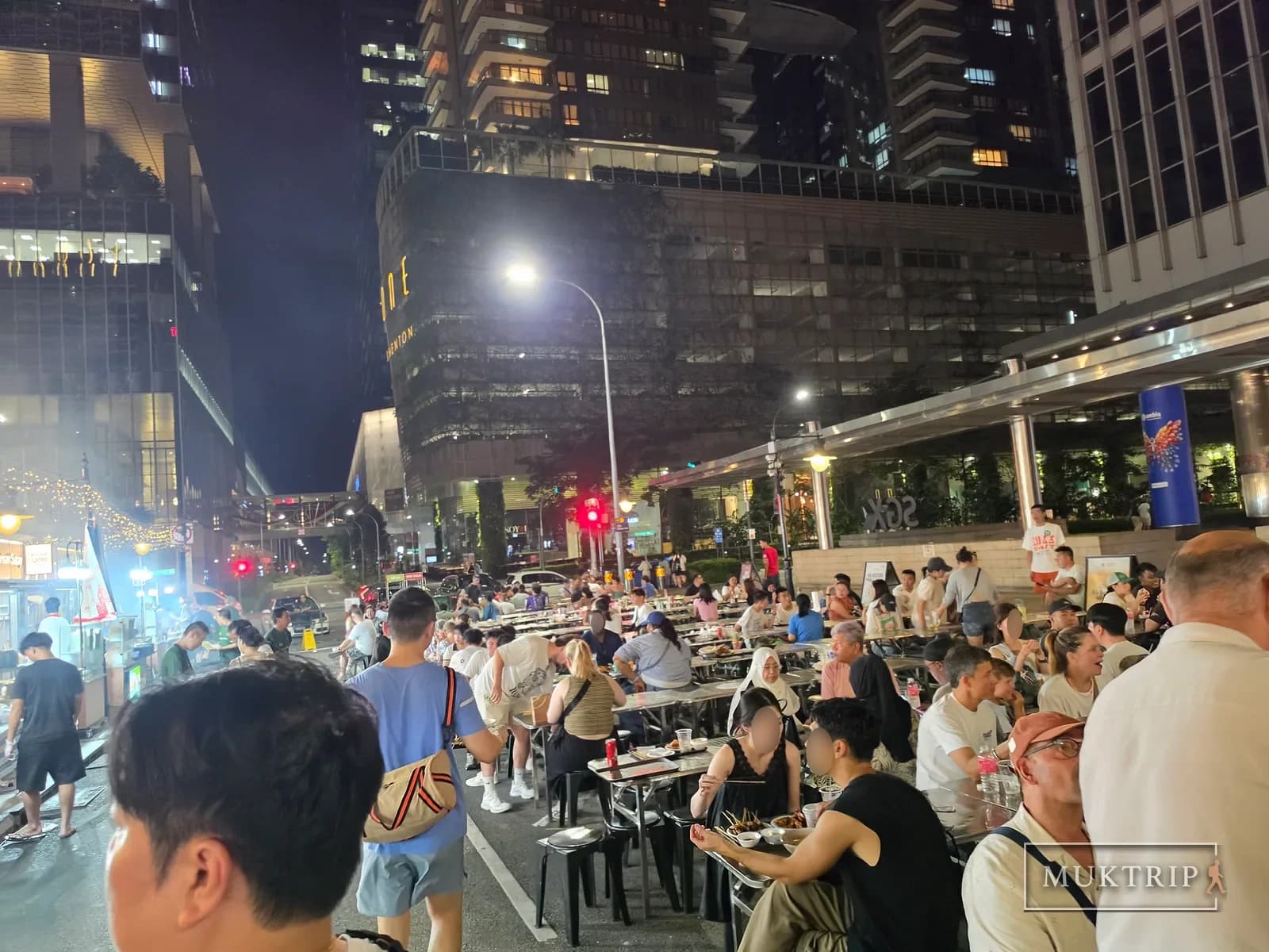 Outdoor tables on the street at Lau Pa Sat