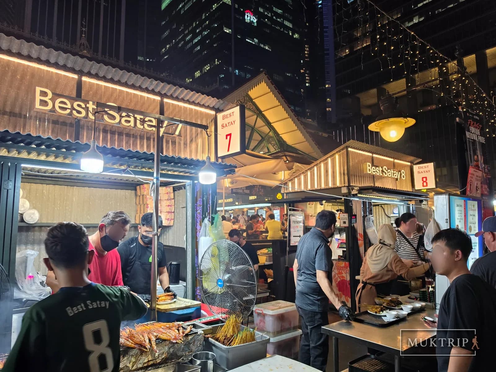Night view of the Best Satay stalls No. 7 and 8 on Lau Pa Sat's satay street