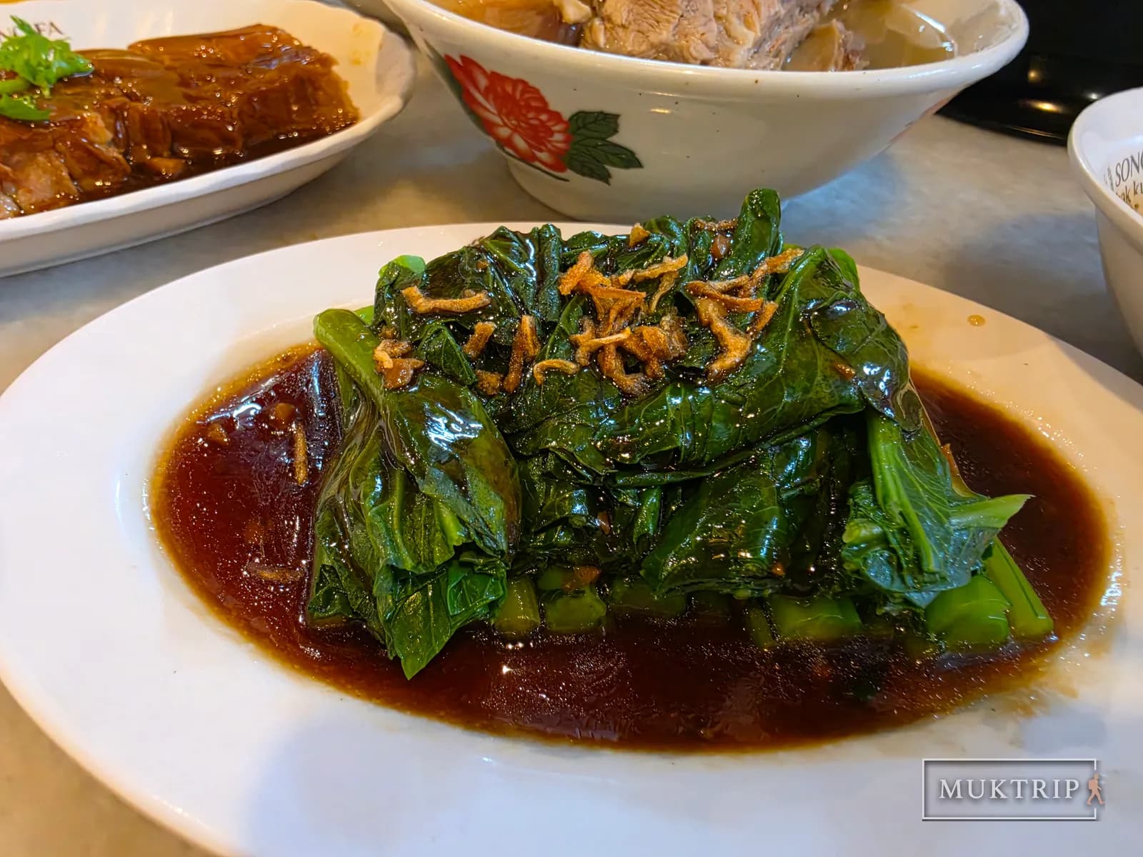 A plate of stir-fried cai xin