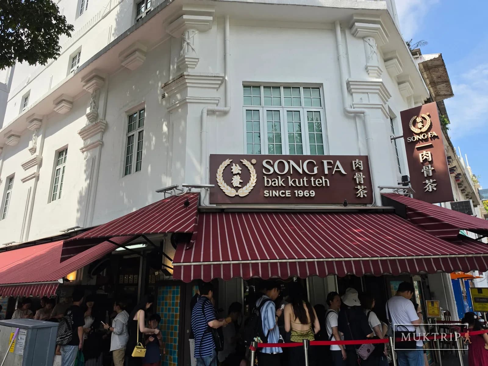 Customers lined up beneath the Song Fa Bak Kut Teh signboard